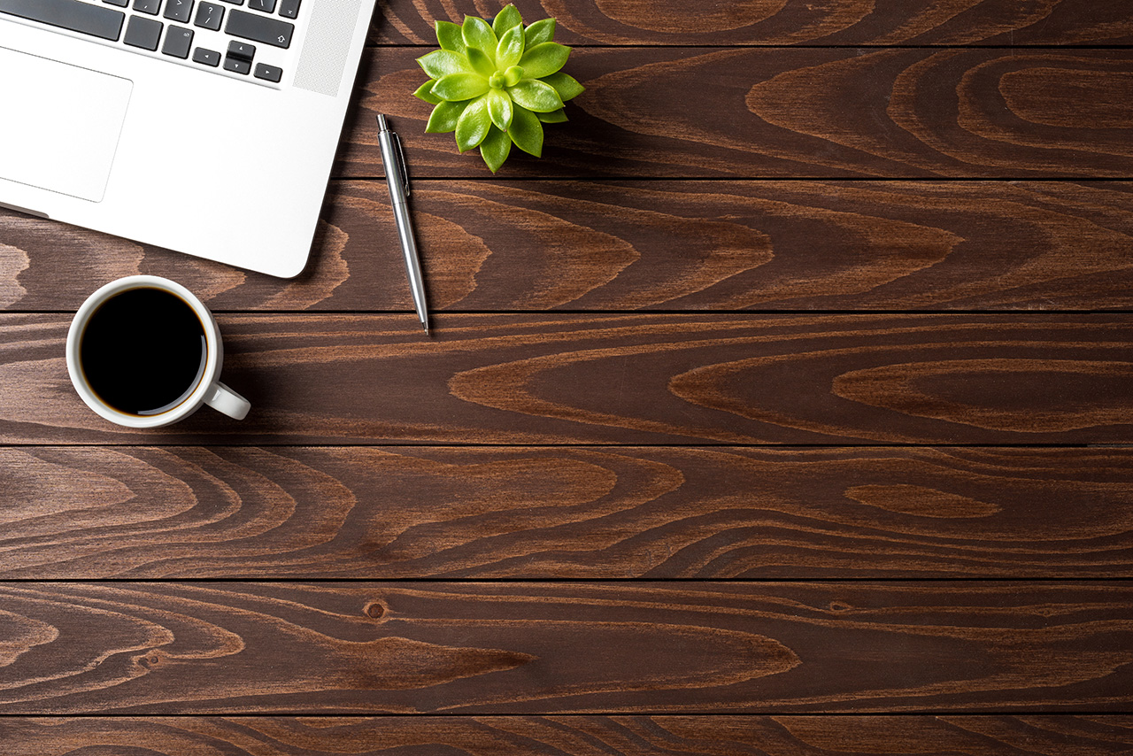 Laptop-with-office-accessories-on-wooden-table